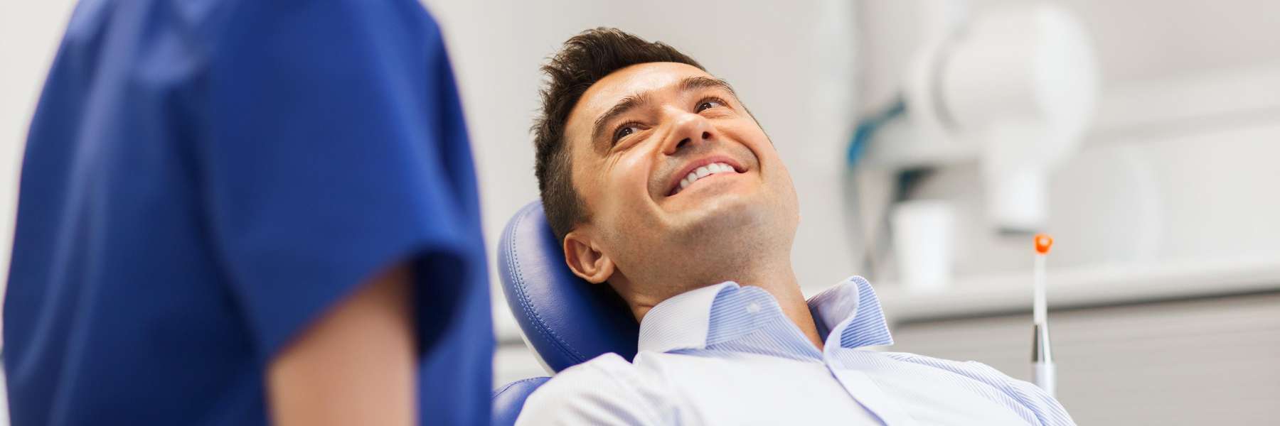man in dental chair waiting for dental implant procedure