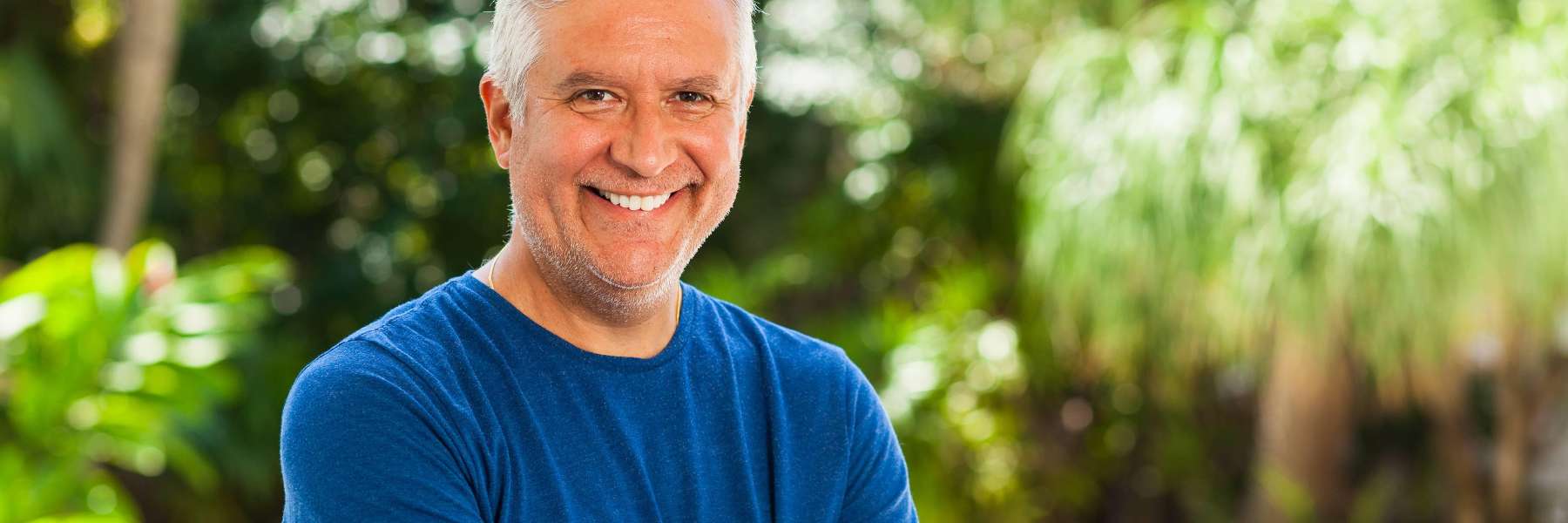 Man with dental implants smiling