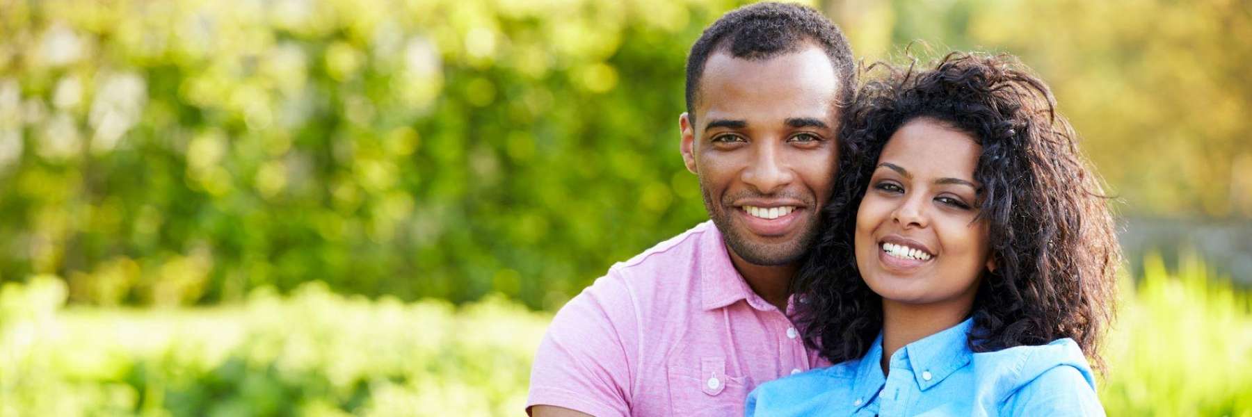Black man and woman smiling and hugging, los gatos ca