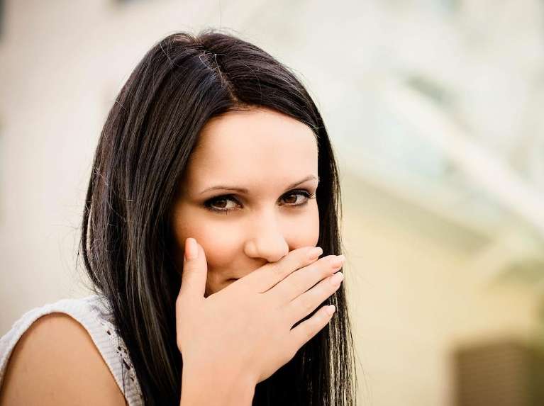 Woman smiling covering her mouth, los gatos ca