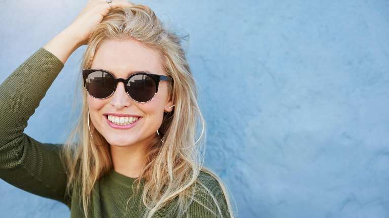 Blonde woman in sunglasses smiling, los gatos ca