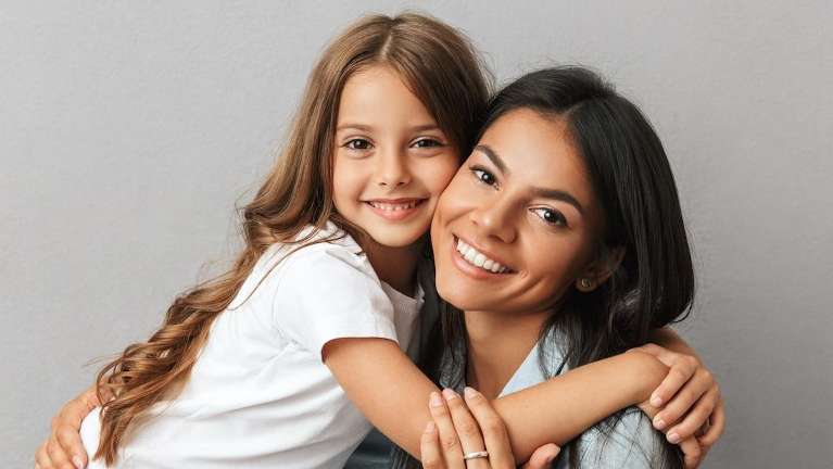 Mom and daughter embracing and smiling, los gatos ca