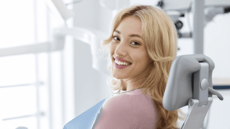 Woman smiling in dental chair before periodontal treatment, los gatos ca