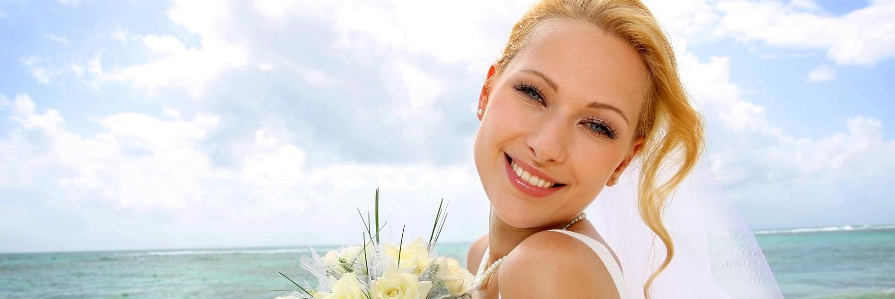 woman smiling on beach l dentist los gatos ca