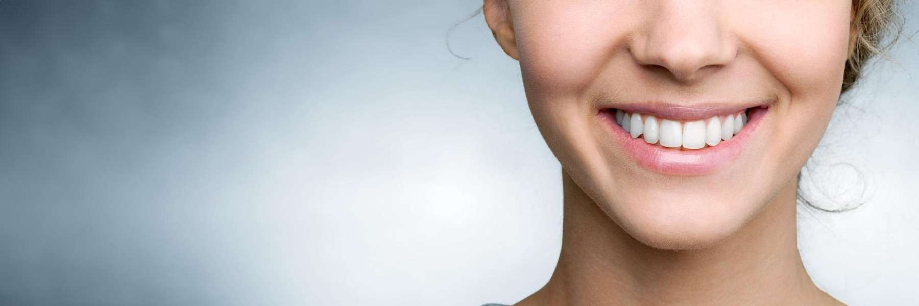 Smiling, cheerful woman creating a welcoming atmosphere for composite filling patients in Los Gatos.