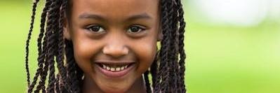 young girl smiling outside l dental cleanings los gatos ca