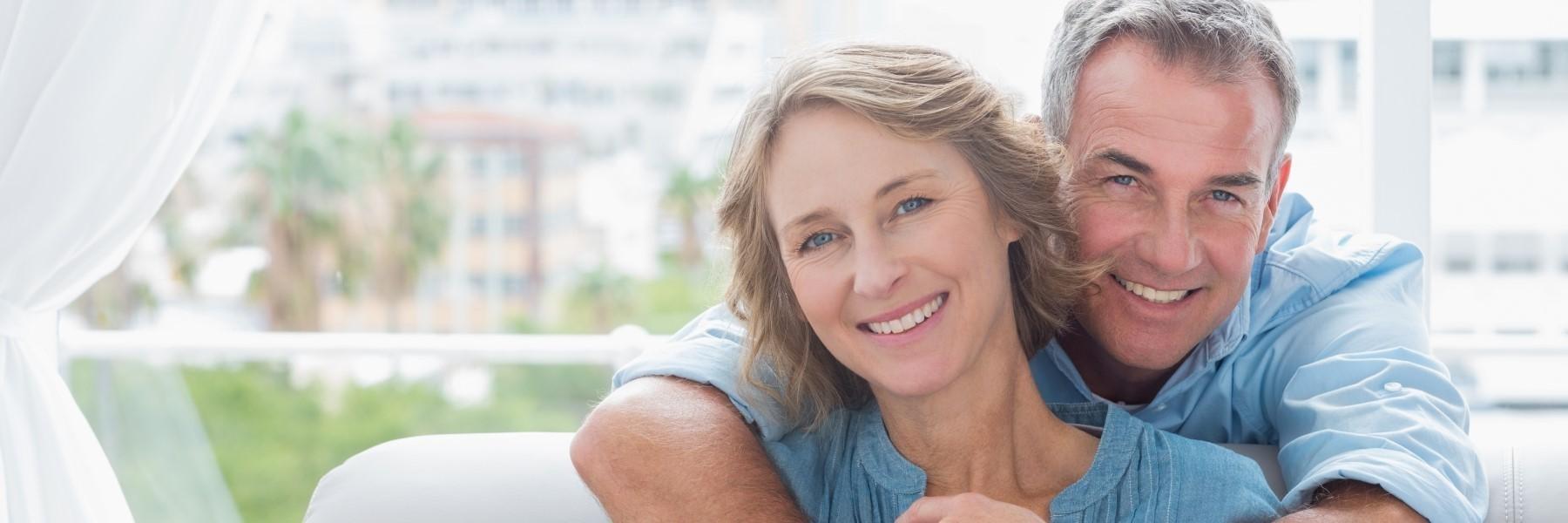 Middle aged couple smiling | dental crowns los gatos ca