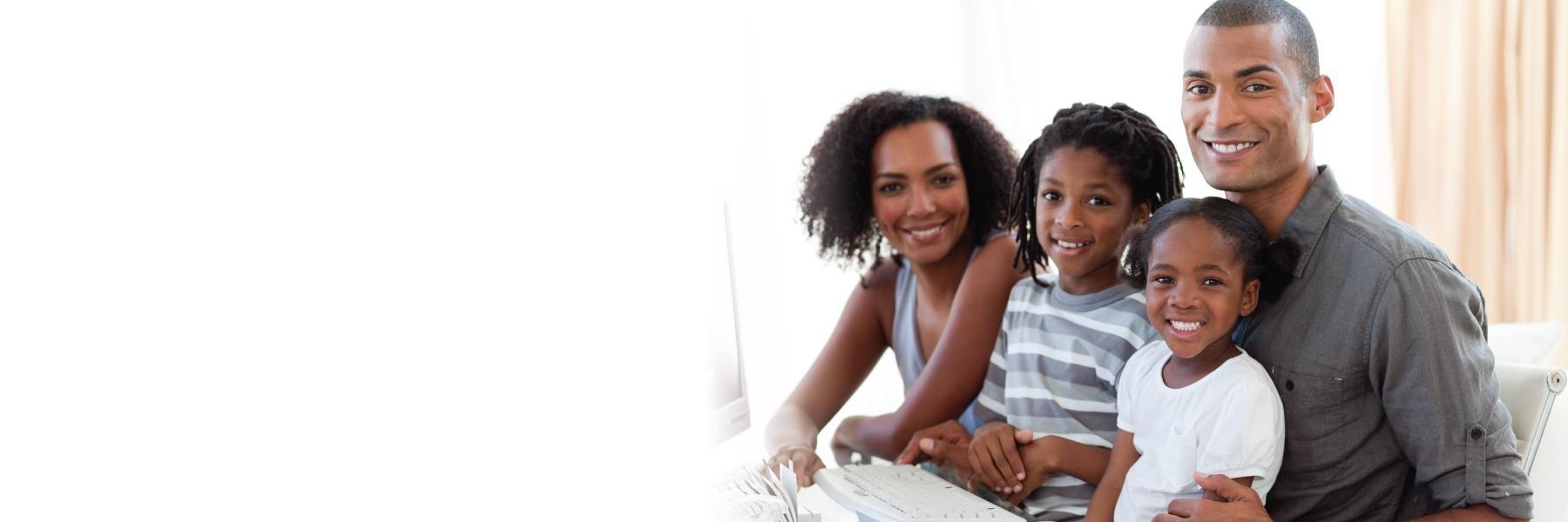 young family of four smiling l dentist 95032